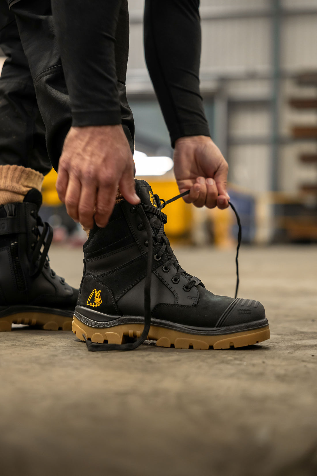 Steel Blue Southern Cross Zip Composite S3 Black Amber work boot, angled view showing scuff cap toe and padded collar and laces 